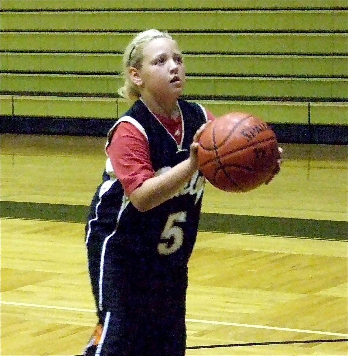 Image: Practice, practice! — Brycelen Richards takes a shot during the camp.