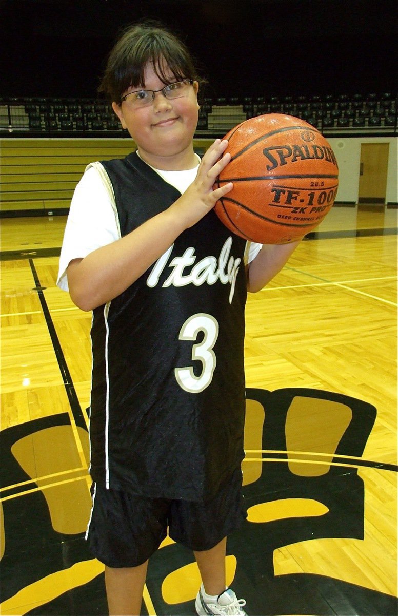 Image: Holden her basketball — Jenna Holden plans to dip this basketball in championship gold as a Lady Gladiator.