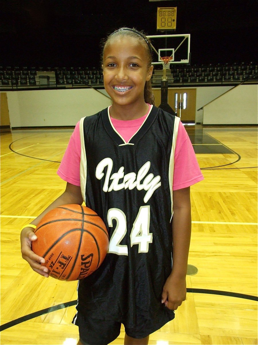 Image: Emily can’t wait — Emily Cunningham modestly poses for her picture during the “Hoop it up’ with Rich and Ro” girls basketball camp in Italy.