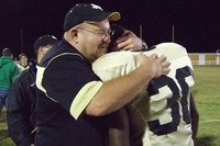 Image: Coach Sollers Consoles — Coach Sollers consoled Curtis Cole after a difficult loss against Itasca.  Curtis will also graduate this year from Italy High School.