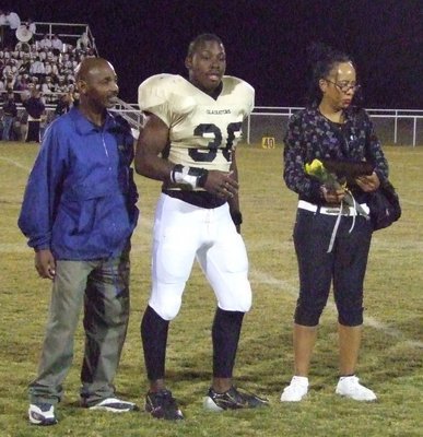Image: Curtis Cole — Curtis is escorted by his family.