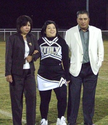 Image: Blanca Figueroa — Blanca is escorted by her parents.