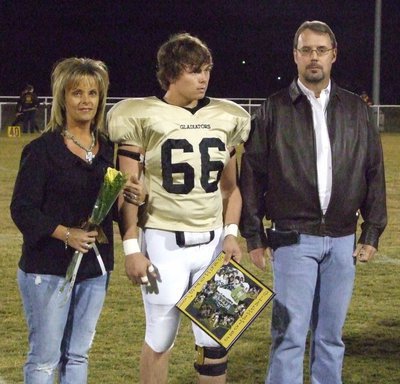 Image: Trent Morgan — Trent was escorted on the field by his family.