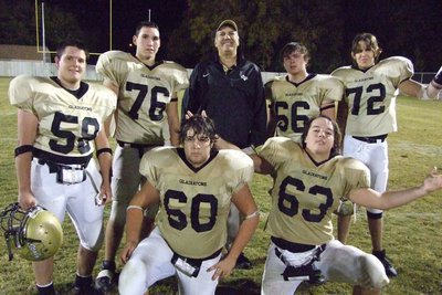 Image: The Offensive Line — Coach Coleman with his special players.