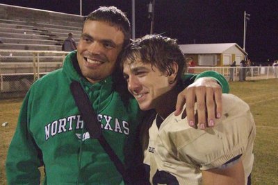 Image: Ben and Clay — IHS Alumni, Gladiator and big brother, Ben Major, takes photo with Clay after the last game.