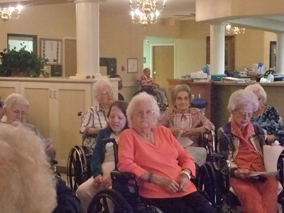 Image: Busy Singing Along — Some of the residents sang and some of them just listened, but all were having a good time.