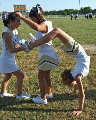 Image: Warning! — Italy Junior High Cheerleaders Sarah Coleman, Ashlyn Jacinto and Haylee Turner recommend you do not try this at home!
