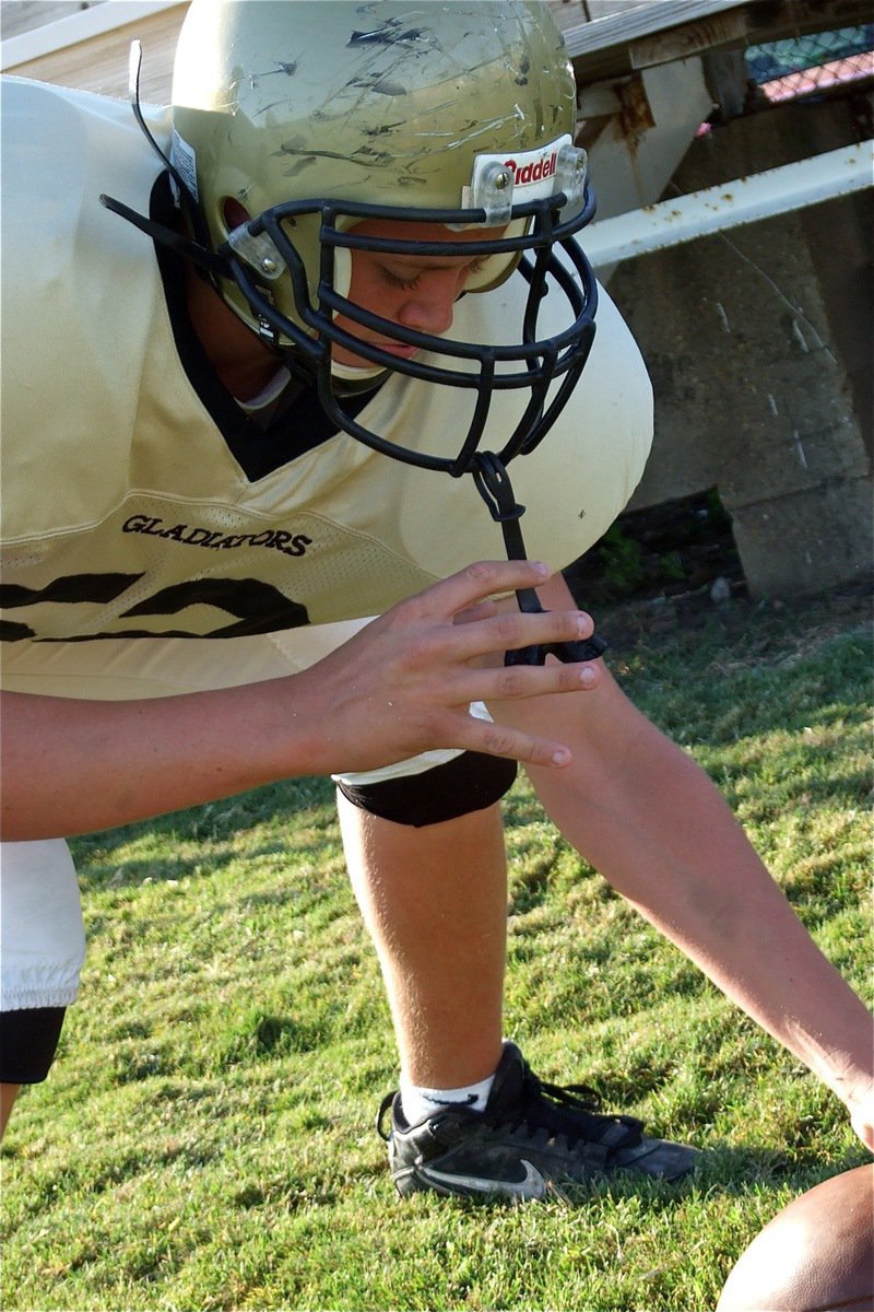 Image: Bailey practices — Bailey Walton practices his snapping technique before the game.