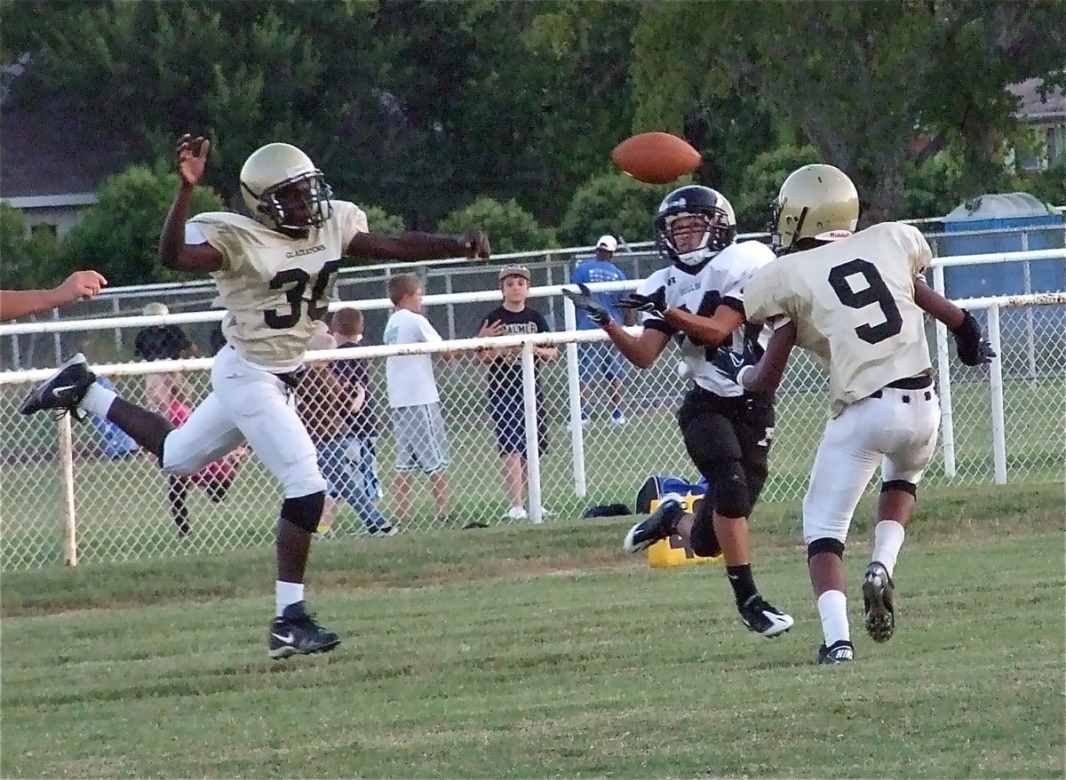 Image: D-flection! — Italy deflects a pass away from the Palmer receiver while Trevon Robertson(9) was in the area to assist.