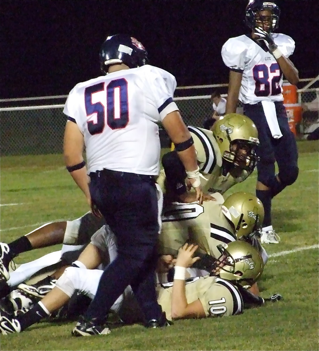 Image: Winning 63-0 over Red Oak Life gives the Gladiators three straight — Gladiator defenders Justin Buchanan(10), De’Andre Sephus(20) and De’Andre Rettig(60) pile it on Red Oak Life to help Italy win their third straight game and post their second consecutive shutout with a 63-0 trouncing over the Mustangs.