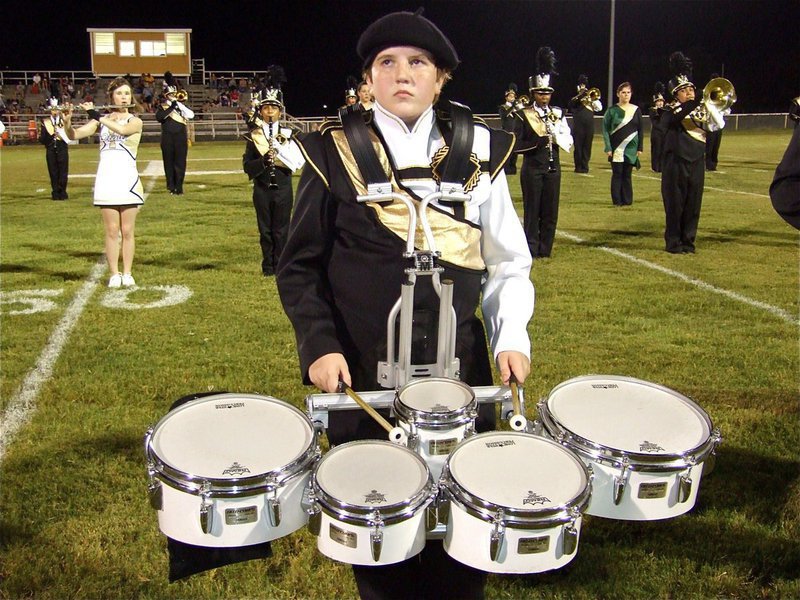 Image: Give Brett a hand — Brett Kirton has both of his hands full with five drums.