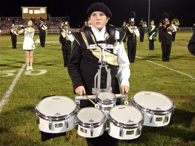 Image: Give Brett a hand — Brett Kirton has both of his hands full with five drums.