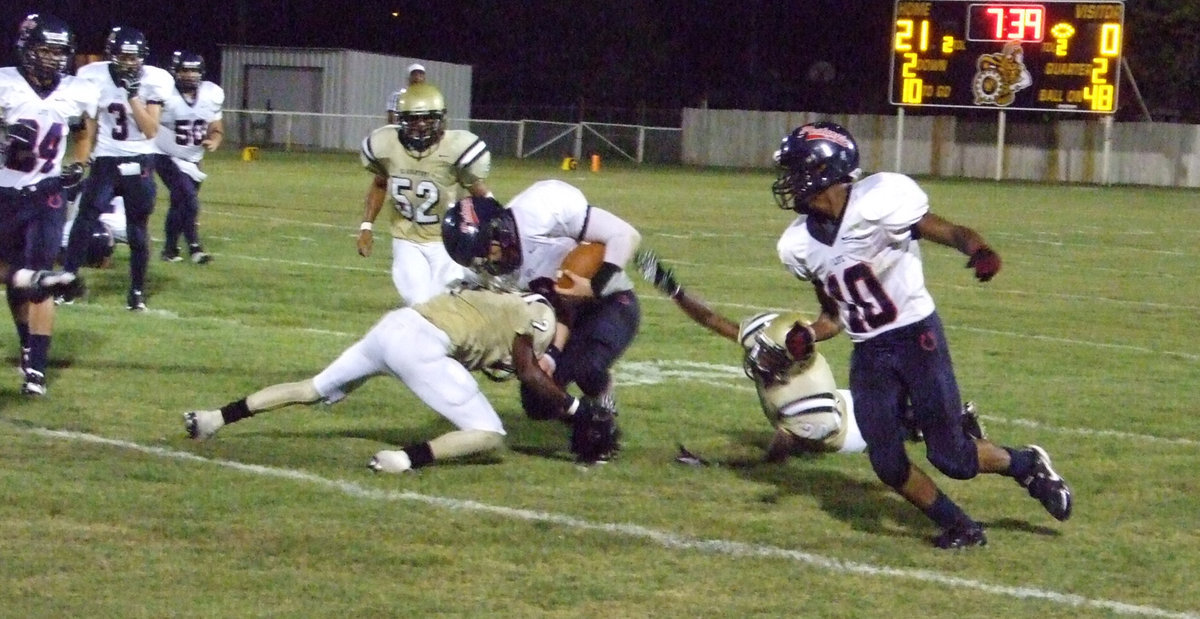 Image: Clemons causes collision — Heath Clemons (2) collides with a Mustang runner to help Italy post their second shut-out in a row.