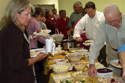 Image: All the fixings — Stafford Elementary Principal Tammy Wallis and Pastor Todd Gray join guests in the lunch line.