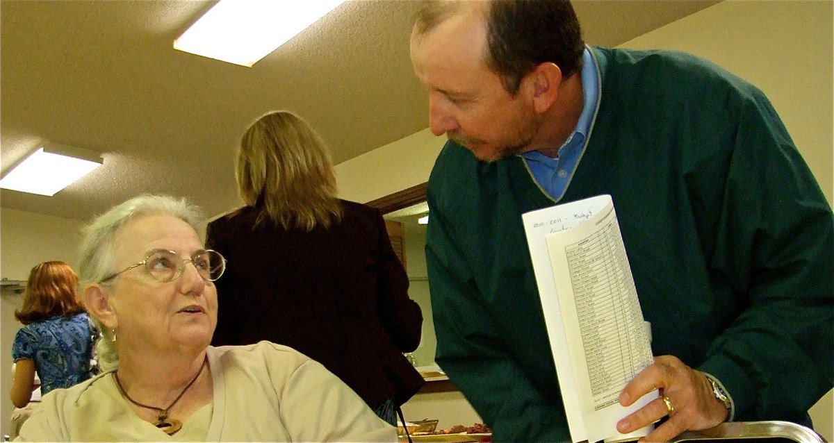 Image: Ann has a question — Italy resident Ann Byers discusses the issues with Commissioner Sims who happens to be her nephew.