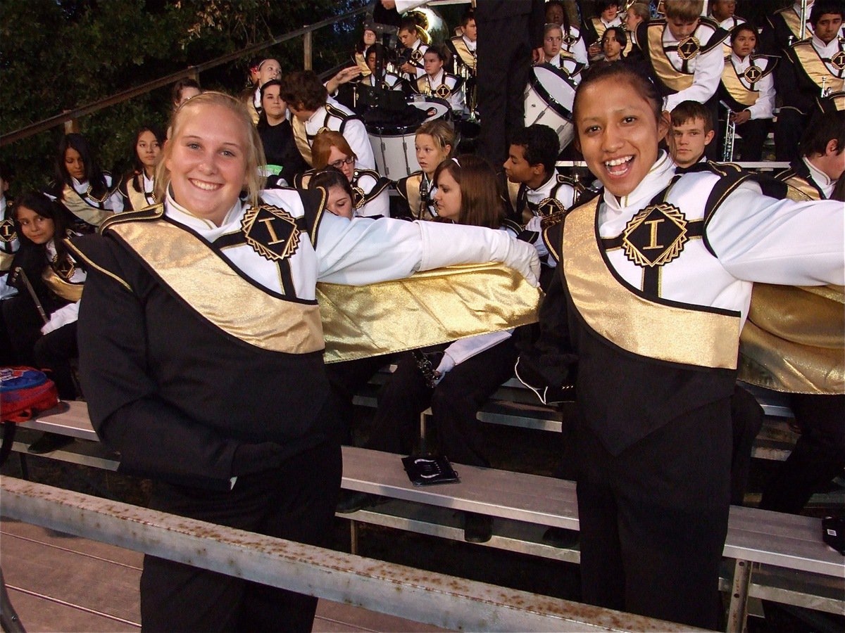 Image: Caped crusaders — Gladiator Regiment Band drum majors Drenda Burk and Jessica Hernandez display their sleek new capes.