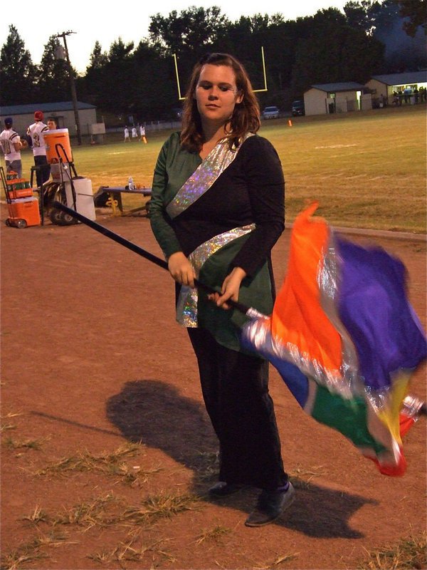 Image: Megan practices — Italy Flag Corp member, Megan Buchanan, practices tricks with her flag during the pre-game.
