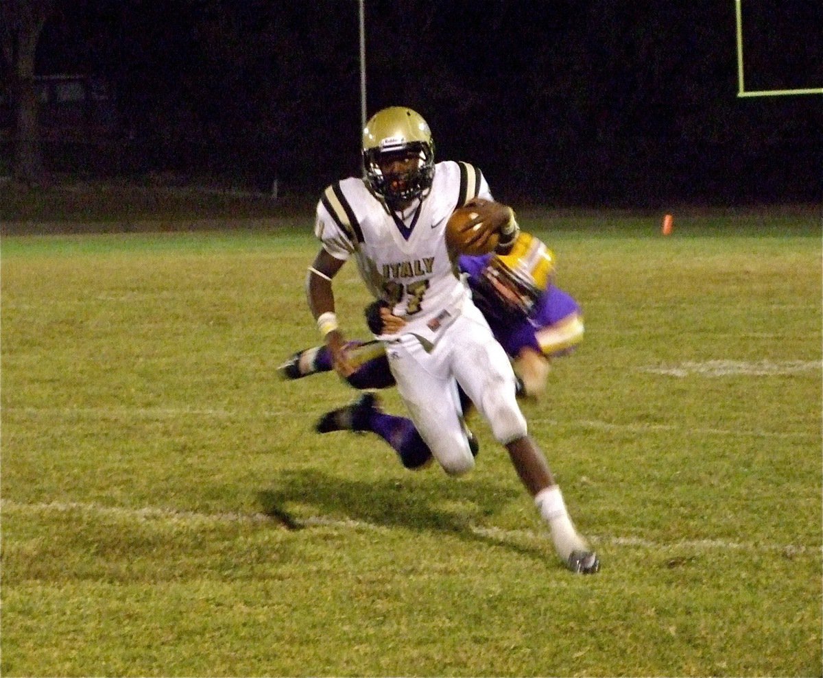 Image: Senio breaks thru — Jasenio Anderson(11) pulls away from a Bison tackler but it was Buffalo that pulled away from the Gladiators with a 41-21 win.