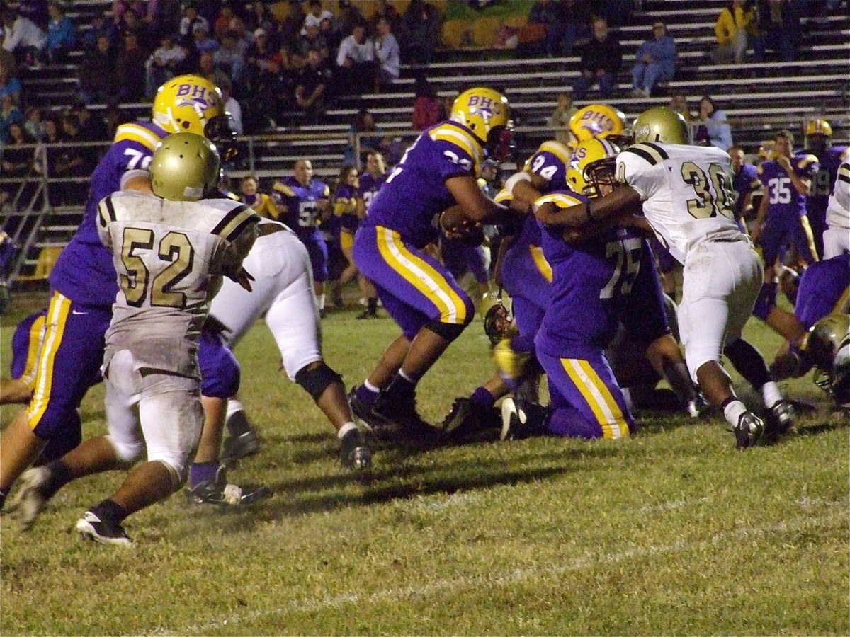 Image: Ground game — Gladiators Jacob Lopez(52) and Jalarnce Jamal Lewis(30) try to hold back Buffalo’s offense.