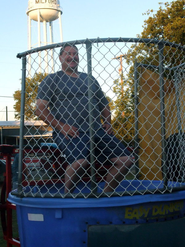 Image: Sitting Pretty! — This is what Milford Police Chief Carlos Phoenix looked like before he got dunked.