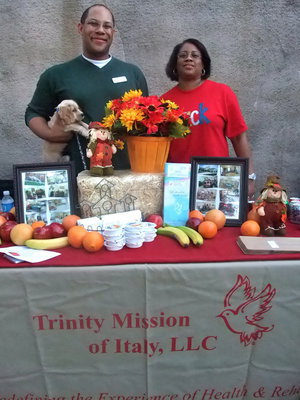 Image: Trinity Mission Booth — Trinity Mission was one of the booths there headed up by Chris Baker (marketing director) and his mother Rosalind Baker. Chris said, “We are out here tonight supporting the Milford Police officers, they do such a great job. We just wanted to be here to show our support.”