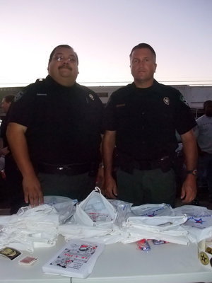 Image: Deputy Hernandez and Deputy Holland — Deputy Hernandez and Deputy Holland said, "We are here with the National Night Out with the Ellis County Sheriff’s office and we are handing out different items on children safety,
