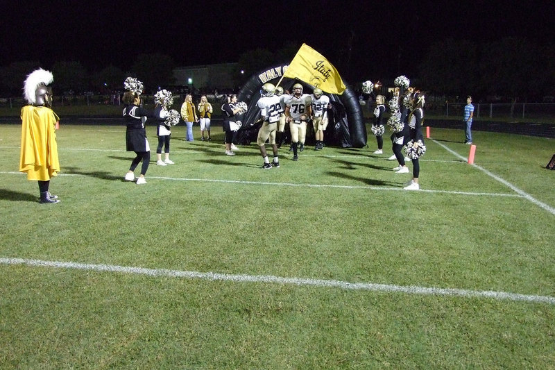 Image: The Gladiators win — The Gladiators bursting out of the tunnel, bearing their banner high and ready to play.