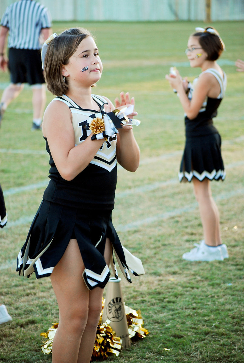 Image: Amber Hooker — Cheerleader Amber Hooker and Kaci Bales keep the Homecoming crowd fired up.