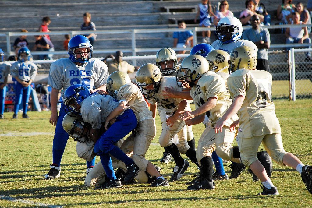 Image: Swooping in — The B-team defense collars a Rice Bulldog.