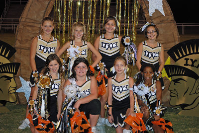Image: Full of Spirit — A-team cheerleaders honored at Homecoming.
