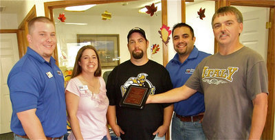 Image: Thank you CNB — Parker Reeves, Sarah Romero, and Diego Garcia with Citizens National Bank of Texas(CNB) in downtown Italy accept CNB’s appreciation plaque from IYAA President Gary Wood and IYAA Vice President Barry Byers. Parker and Diego recall having to play in other towns as youngsters and are glad Italy has a youth athletic organization.