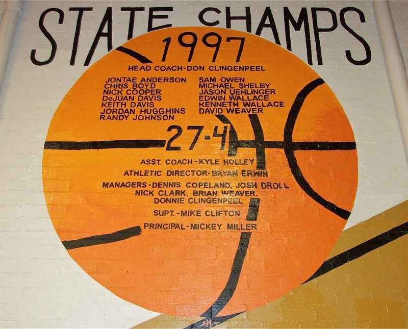 Image: Stacy McDonald repaints 1997 State Champs basketball mural — The 1997 State Champs basketball homage originally painted by Stevan McKey to honor the Class 2A Italy Boys Basketball Champions was recently retouched by current Lady Gladiator head basketball coach Stacy McDonald.