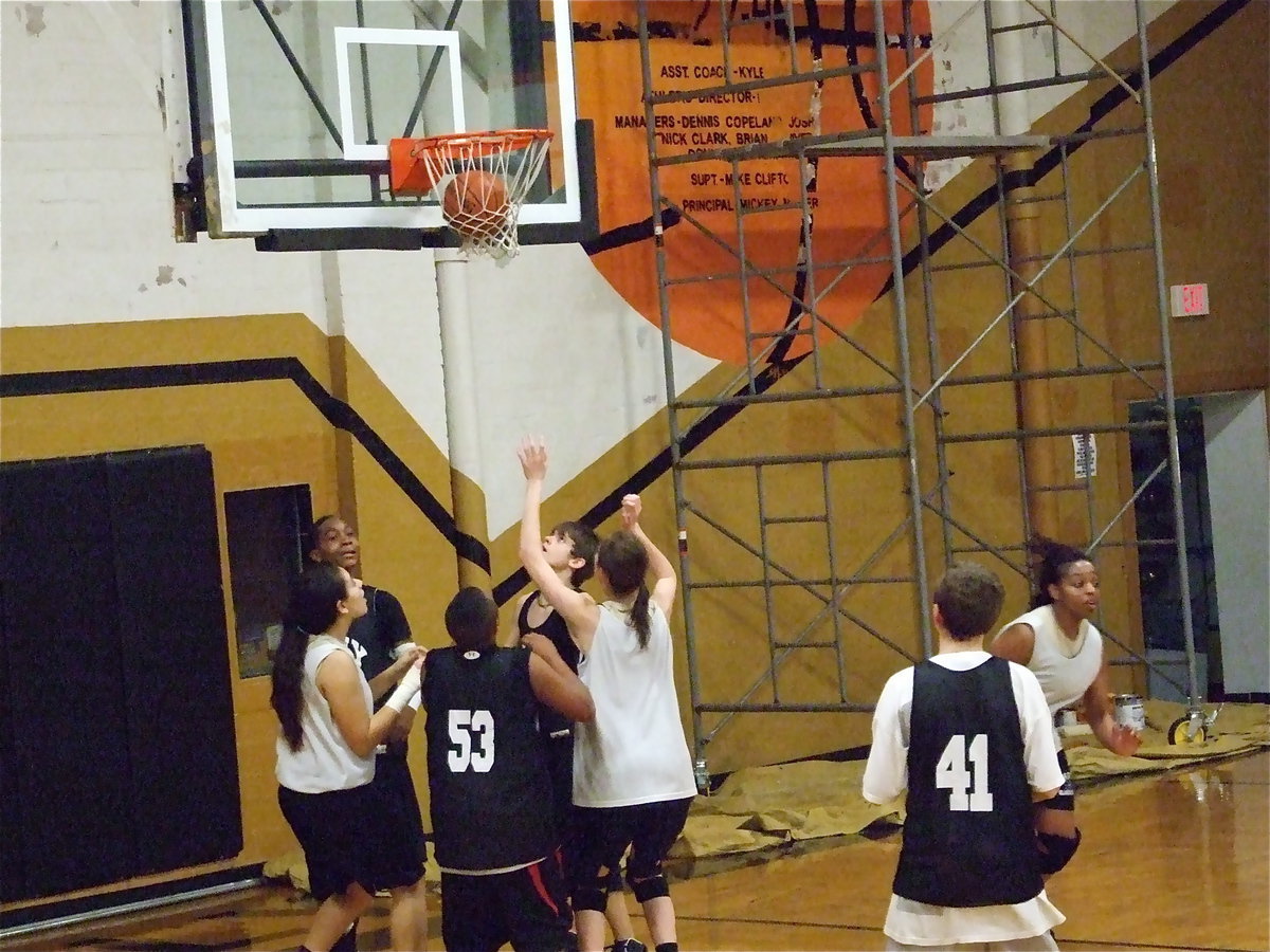 Image: Whatever it takes — During their playoff run, the scaffolding can be seen in the background as coach Stacy McDonald’s Lady Gladiator Basketball team scrimmaged against the 8th Grade Boys.