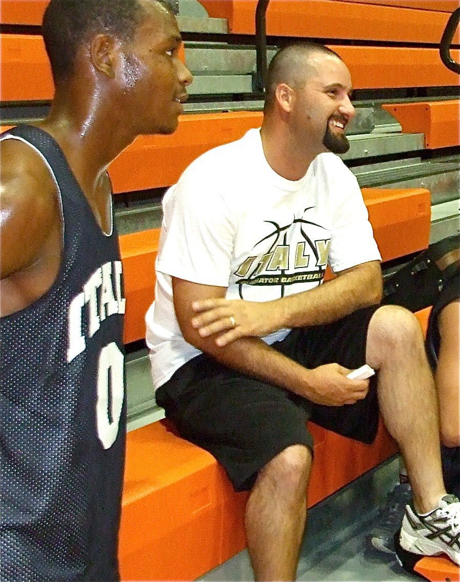 Image: Fun-n-gun — De’Andre Sephus and volunteer coach Shawn Holden stay loose during a timeout.