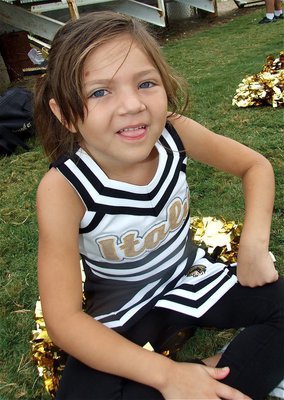 Image: Emma Martinez — Emma takes a moment to watch the game before getting her cheer on.