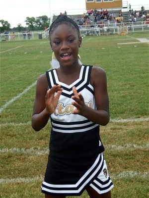 Image: Shaniaya Johnson — A multitasker, IYAA Cheerleader Shaniaya Johnson cheers, claps and dances all at once.
