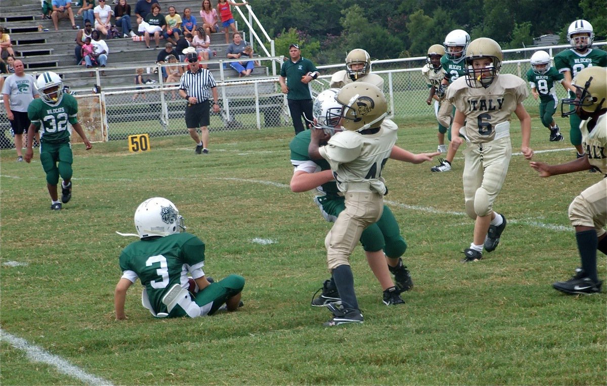 Image: Be afraid! — IYAAs Tyvon Gates forces the Wildcat kick returner to take a seat.