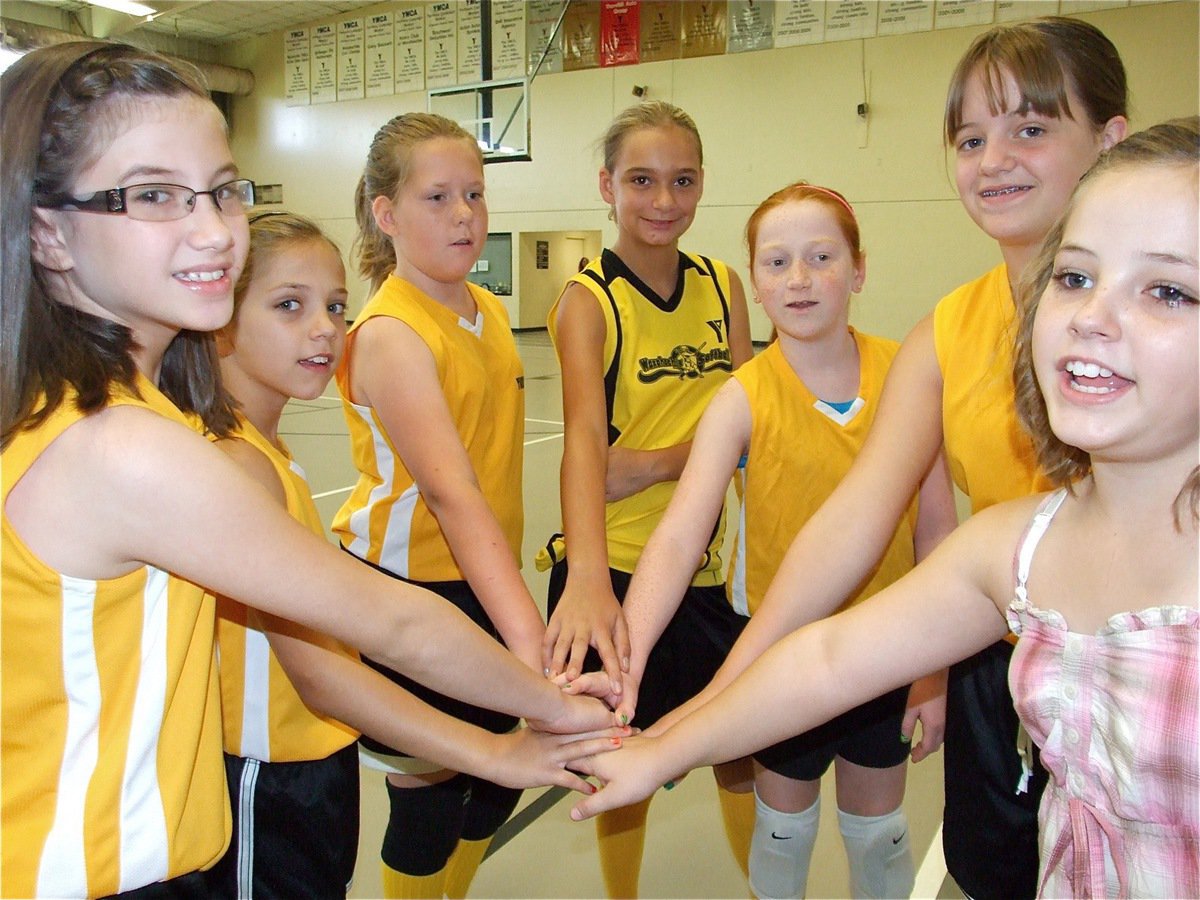 Image: Whoa, Wild Thangs!  — The Wild Thangs huddle: L to R: Callie Manutai, Haley Bowles, Katie Wingo, Cassidy Svehlak, Zoe Brignon, Brooke Salter and cheer coordinator Peyton Bowles.