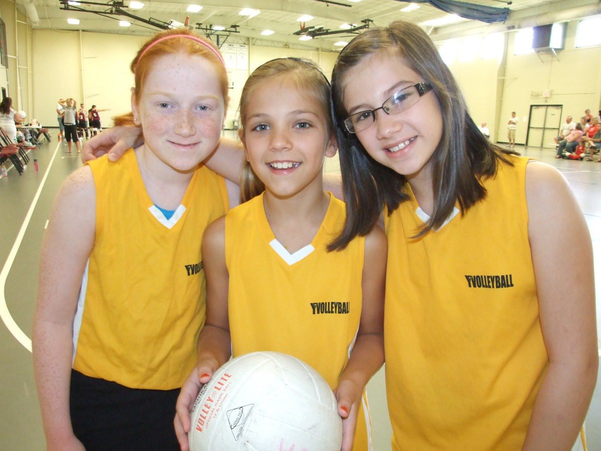 Image: Wild and three — Zoe, Haley and Callie unite before their game against the Purple People Eaters.