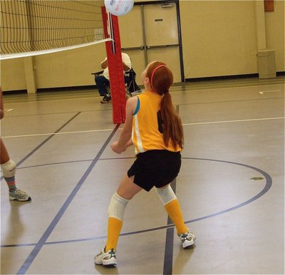 Image: Zoe’s got skillz — Zoe Brignon is about to return the volleball from the middle blocker position.