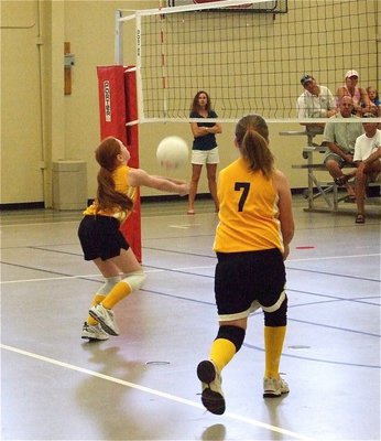 Image: Wild Thangs attack — Zoe and Katie charge the net inside the attack zone of their offensive set.