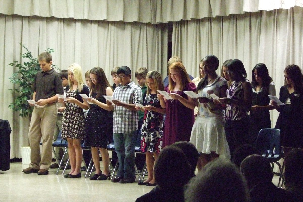 Image: The Pledge is taken — The new members read their pledges.