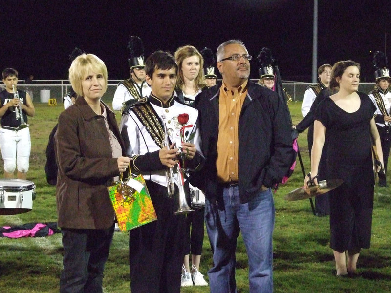 Image: Collier — Collier Jacinto and his family were presented a graduating rose.