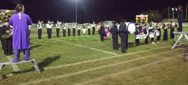 Image: Batman begins — The band plays their award winning performance during halftime Friday night.