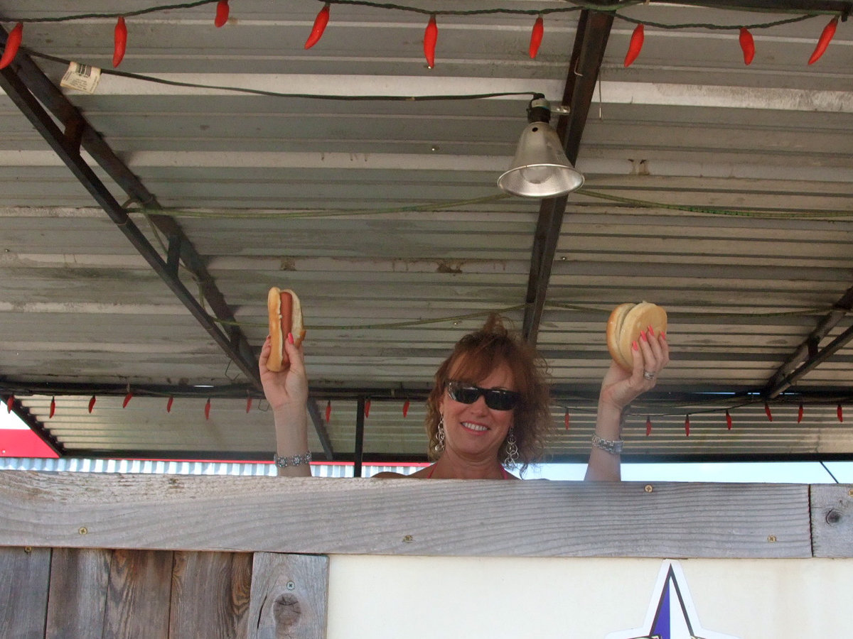 Image: Cindy Teer — Cindy is busy serving the hamburgers and hot dogs.