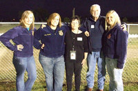 Image: Honored Veterans — The FFA take time to smile with our honored veterans, Karen Mathiowetz and Joe “Spit” Knott. Mathiowetz graduated from IHS in 1968 and served in the US Air Force. Knott graduated in 1949 and served in the Marines.