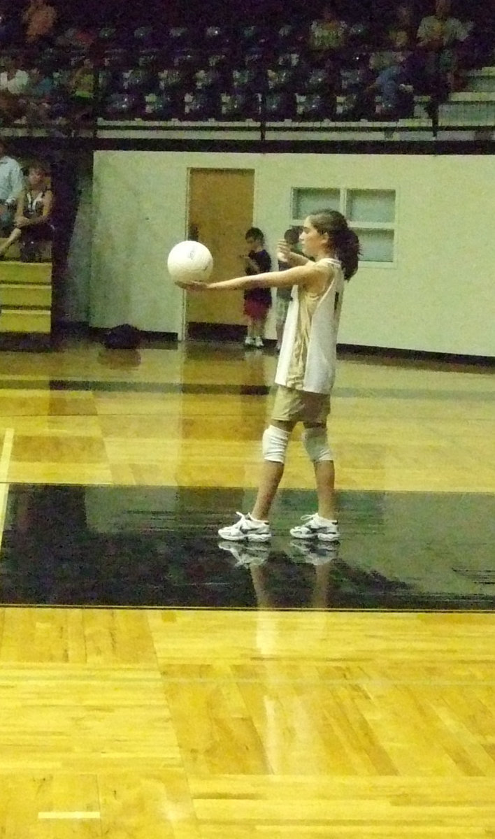 Image: Serves up — Cassidy Childers (1) serves up the first ball.