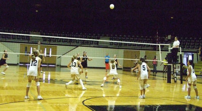 Image: 7th grade is ready — Hannah Washington (13) and Brit Chambers (2) attack the net.