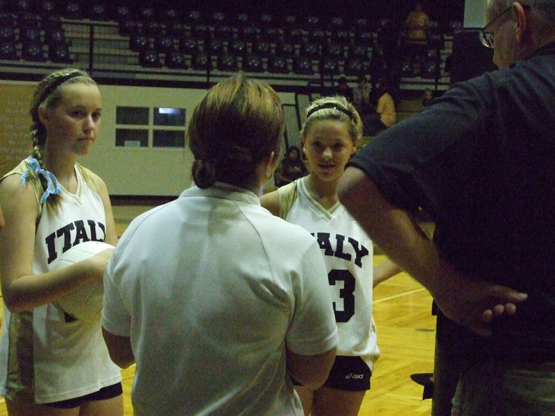 Image: Captains get the word — Kelsey Nelson (25) and Bailey Eubank (23) listen to the officials before the game.