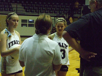 Image: Captains get the word — Kelsey Nelson (25) and Bailey Eubank (23) listen to the officials before the game.